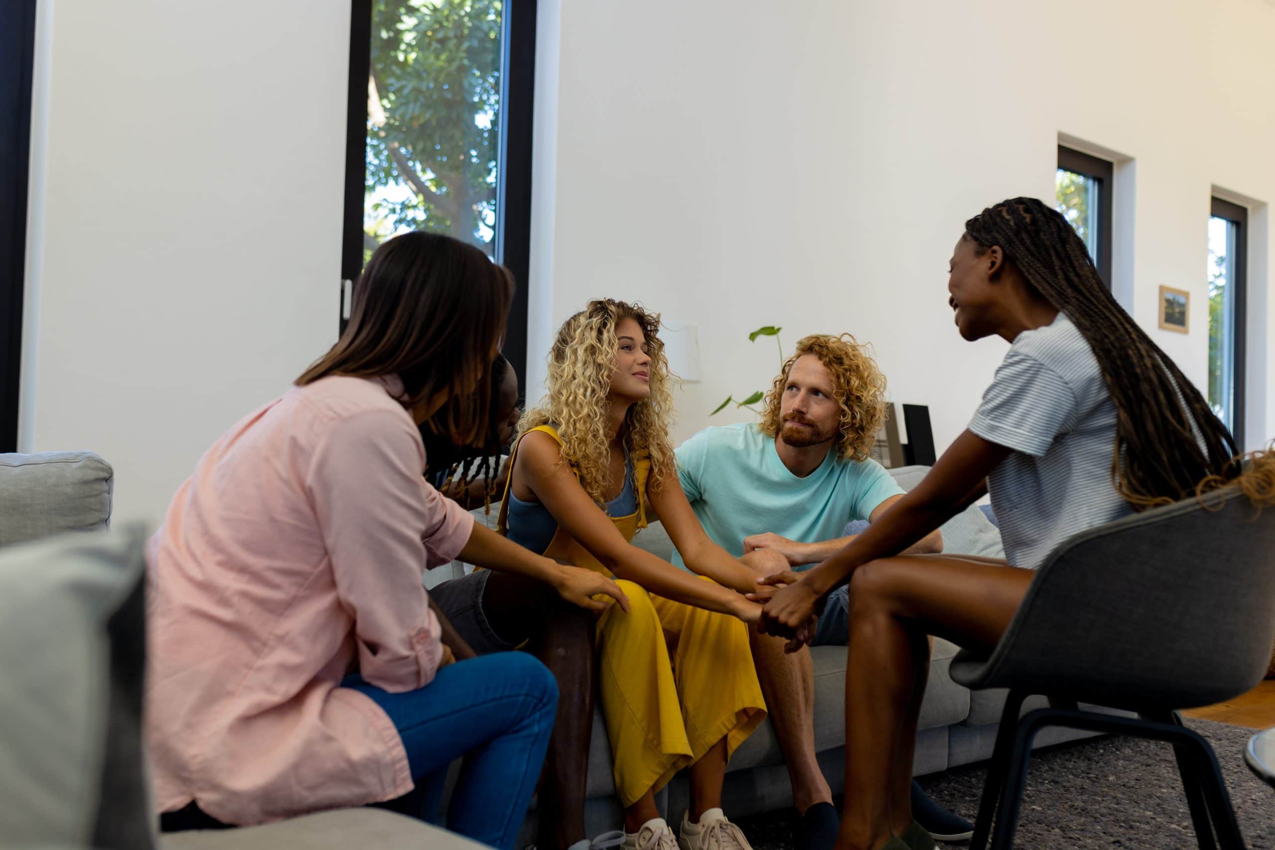 Group of people talking in therapy at detox madison​.